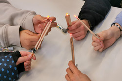 Girls hold illuminated ladders together