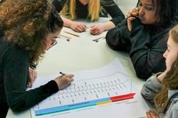 Girls work together on a task.