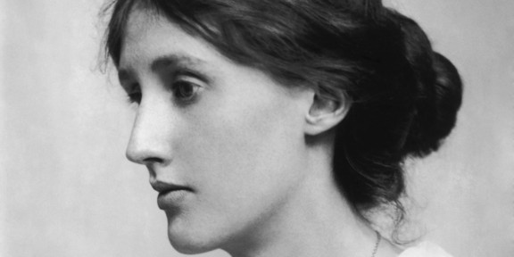 Side portrait of a young woman in black and white.