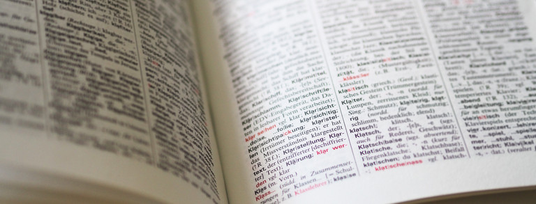 Page from the dictionary with the definition ‘clarify (remove errors), he has clarified the misunderstanding’