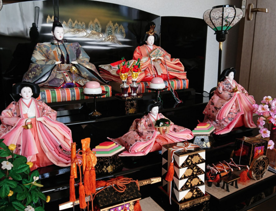 Traditional Hinamatsuri porcelain dolls in colourful kimonos.